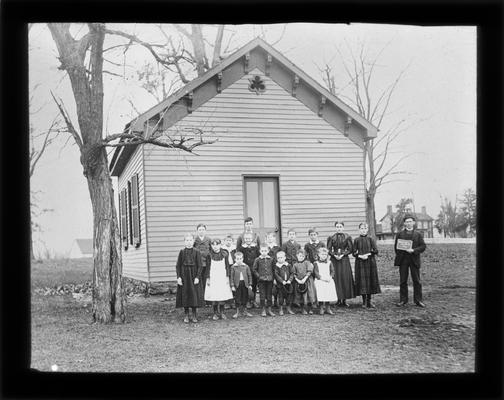 Students outside Parker's Mill School (later called Wolf Run) with Mr. C.S. Sousley, teacher