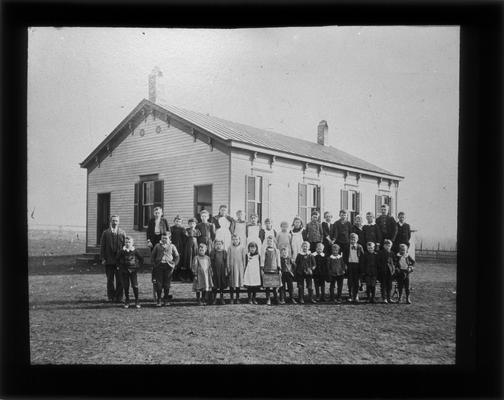 Students outside East Hickman School with Miss Mary Dodd, teacher