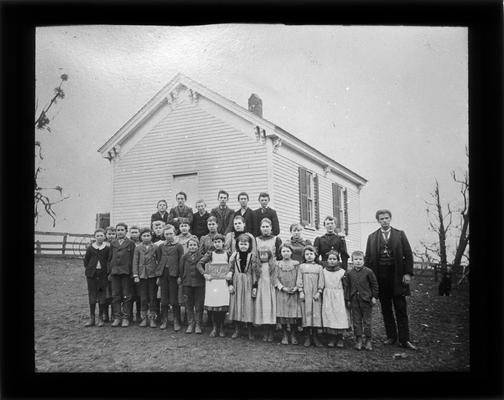 Students outside Briar Hill School with Mr. A.M. Cox, teacher