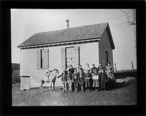 Students outside Hearne School, on Richmond Pike, with Miss Julia Watts, teacher