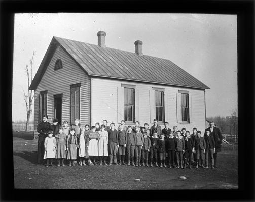 Students outside Mt. Tabor school with Miss Hill, teacher