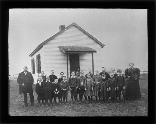 Students outside Lyle School, on Leestown Pike, with Miss Hettie Rouse, teacher