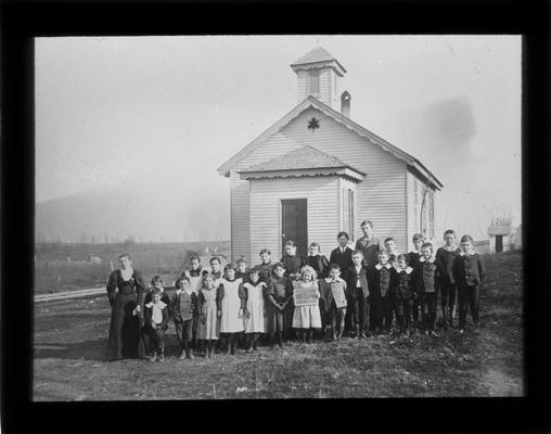 Students outside South Elkhorn School with Miss Emma Watts, teacher