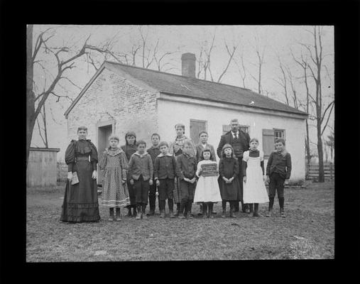 Students outside Locust Grove School on Military Pike with Miss Mattie Christian (later Patterson), teacher