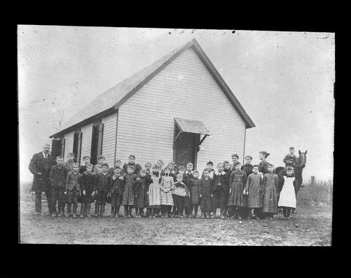 Students outside Donerail School with Miss Laxham, teacher