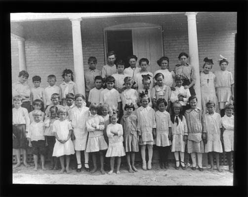 Students outside Old Elmendorf School, also known as Little Brick