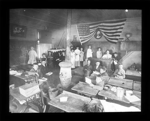 Interior of the Old Brighton School, with students and teacher