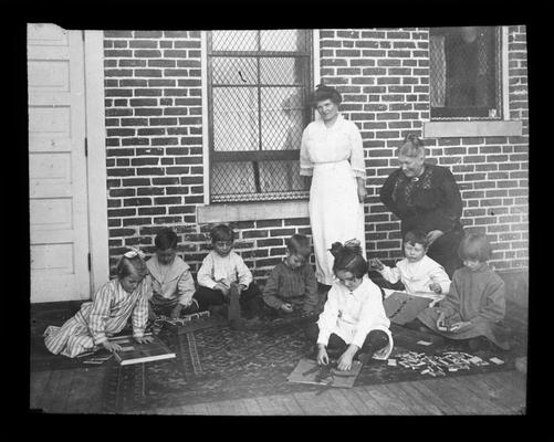 Miss Belle McCubbing, right, with Picadome Montessori students and Mrs. Nannie Faulconer, standing