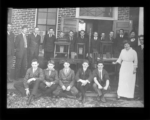 Picadome manual training students display work with Mrs. Nannie Faulconer, in white, Miss. Margaret McCubbing and instructor Oriville Croder