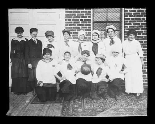 Picadome girls' basketball team with Mrs. Nannie Faulconer in white. Camilla Spain Sullivan is the coach. Miss Willie Carr is one of the players