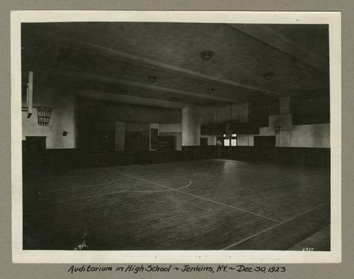Title handwritten on photograph mounting: Auditorium in High School--Jenkins, Kentucky