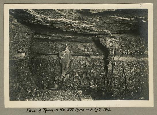 Title handwritten on photograph mounting: Face of room in No. 205 Mine