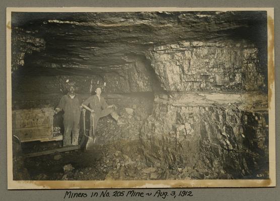 Title handwritten on photograph mounting: Miners in No. 205 Mine