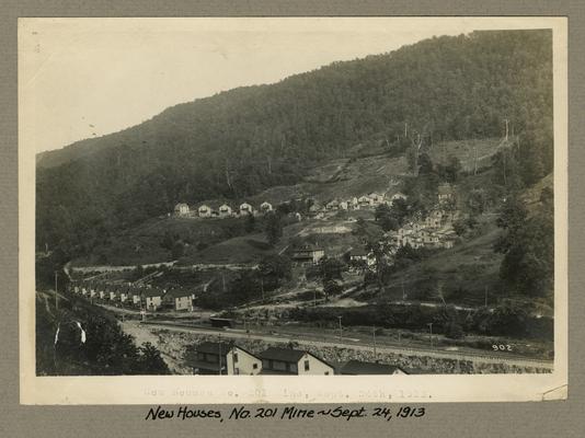 Title handwritten on photograph mounting: New Houses, No. 201 Mine