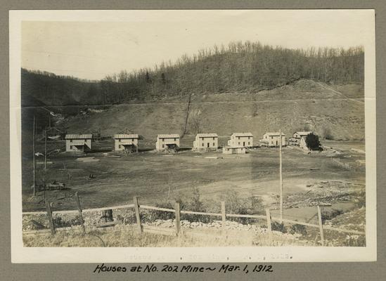 Title handwritten on photograph mounting: Houses at No. 202 Mine