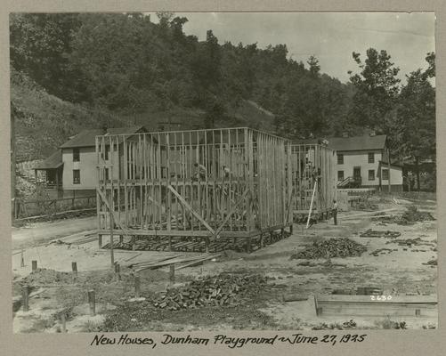 Title handwritten on photograph mounting: New Houses, Dunham Playground