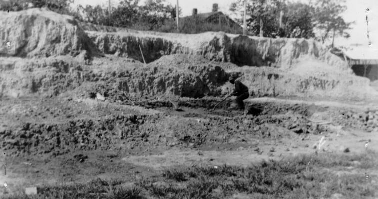 Project #1-73-27-68 District 1, Branch District 3: Photograph 1 in a series showing the various steps in manufacturing brick to be used in building a 10' wall around Keiler Athletic Field in Paducah, KY. Excavating and 