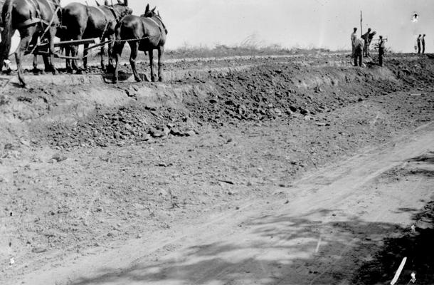 Project #2 District 1: Construction of the Clay to Bordley highway. This project involves the grading and draining of approximately 5.5 miles of road. This project is sponsored by the State Highway Department who furnish majority of equipment and supplies. Plowing banks to loosen earth so it may be loaded into trucks