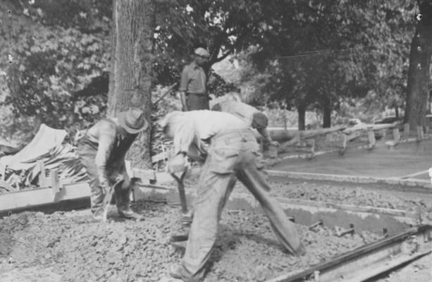 Project #85 District 4: Construction of concrete driveway at Eastern State Teachers' College, Richmond, KY. Placing and spreading concrete around dowel expansion joint