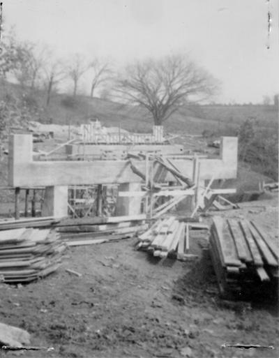 Project #19 District 2: Construction of a reinforced concrete bridge and approaches thereto on Kirkwood Pike. This project replaces an old all-wood covered bridge in a new location. A full view of the new structure from the centerline of the new location