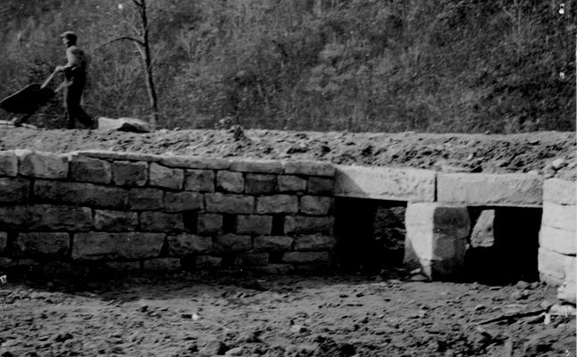 Project #36 District 5: Construction of highway, including grading, draining and surfacing, beginning on State Highway Route No. 40 on Buck Creek at Beauty, KY, a distance of two miles. View of a double box culvert, constructed with native stone