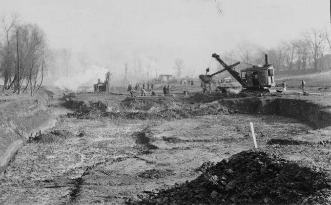 Project #110 District 6: Construction of a harbor for pleasure boats on the Ohio River at Louisville. Evacuation of basin showing dike and Ohio River at left of picture. Photographed December 9, 1935