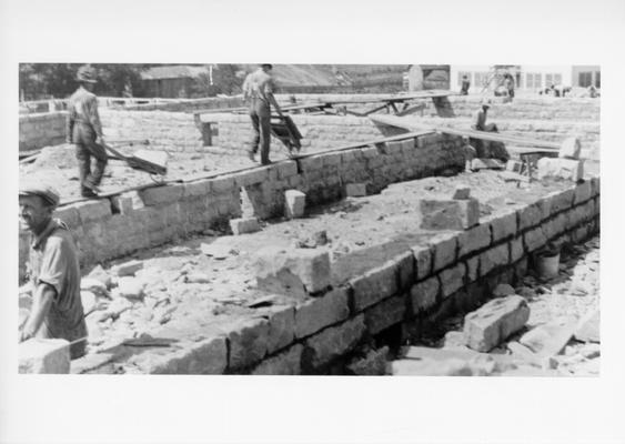 Project #103 District 5: Project #103 is for the construction of an 18-room native stone high school building at Hyden, KY. View, photographed July 8, 1936, shows foundation for the new school