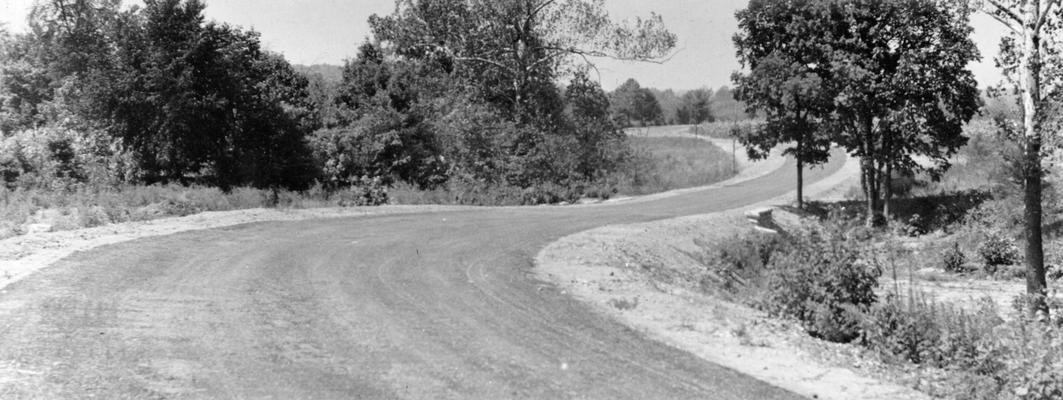 Project #250, Master Project #2784 District 6: Project #250, now a part of Master Project #2784, provided for the reconstruction of 4 miles of the Route Road and Ferman Road in Jefferson County. Completed section of the road showing bituminous macadam wearing surface. Photographed August 29, 1936