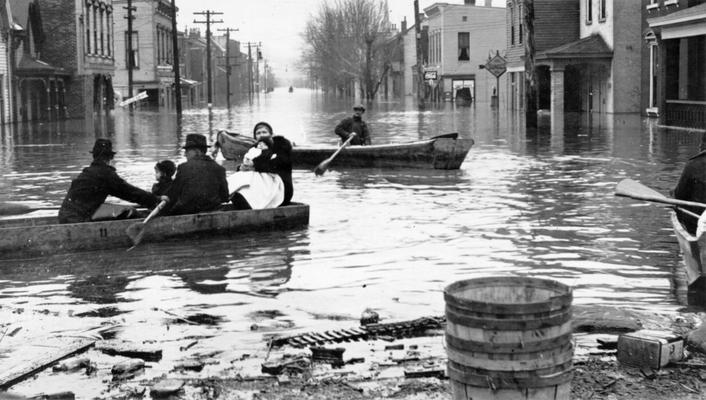 1937 Flood. Evacuating a family at Newport, KY. WPA boat bringing in a marooned family at Newport, KY. View photographed January 27, 1937