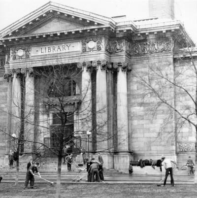 1937 Flood. Repair and clean-up work. WPA men cleaning the walks, drives and lawn of the Louisville Free Public Library at Fourth and York streets. View was photographed February 4, 1937