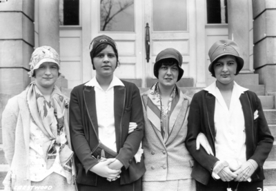 Unidentified individuals from Crestwood, Kentucky visiting the University, standing in front of Miller Hall