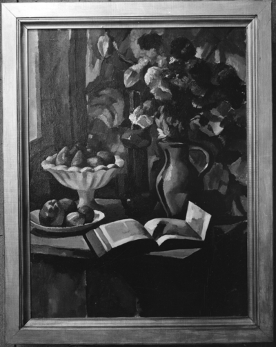 Still life of flowers in vase, fruits, pitcher and book displayed on table