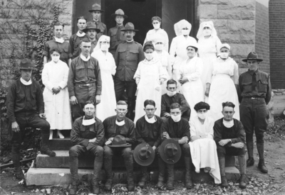 Nurses, Captain Royden, and medical officers; nurses in Gymnasium Hospital During influenza epidemic