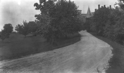 Unpaved road leading to the Administration and Gillis Buildings