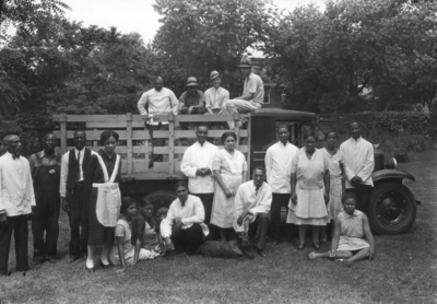 Senior Breakfast Alumni Tea, African-American servers in first row and yard workers on truck