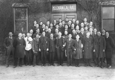 Group photograph on steps of Mechanical Hall, the original Anderson Hall, American Association of Engineers, two people with unknown position are Tom Foster, and William Kidwell