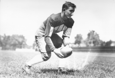 Kentucky football player with ball, (