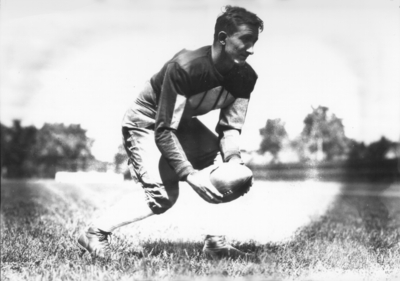 Kentucky football player with ball, (