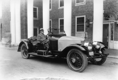 Charles H. Anderson, Professor of Engineering Design, 1919 - 1938 seated in his 1921 Rolls Royce car in front of Kinkead Hall