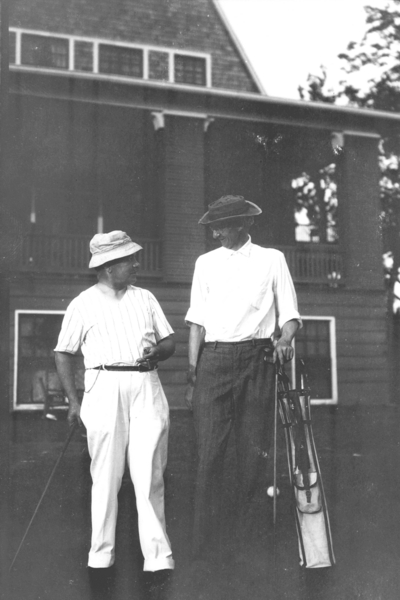 Dean F. Paul Anderson, Engineering, and unidentified man with golf clubs