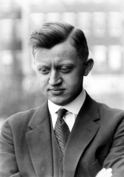 Unidentified man looking down away from camera