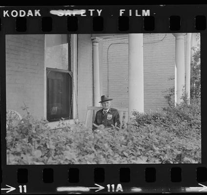 Elderly man porch