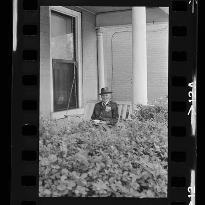 Elderly man porch