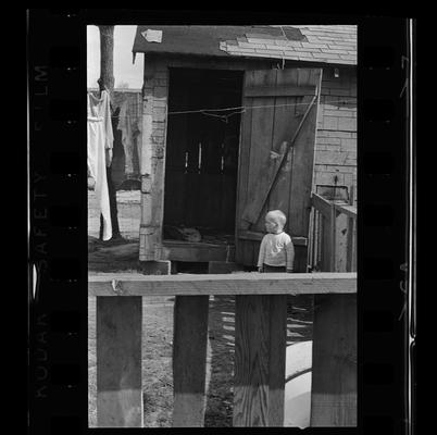 A woman and child, Two children, A child standing by door