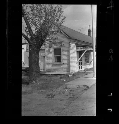 East End Real estate office, African-American man sitting