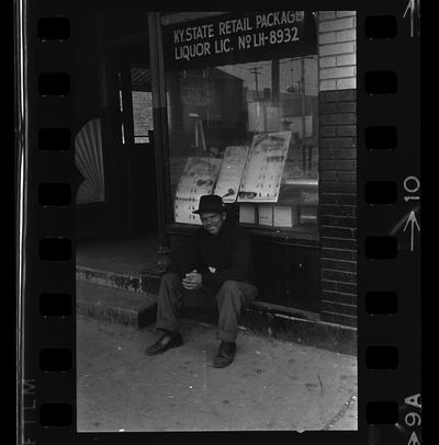 East End Real estate office, African-American man sitting