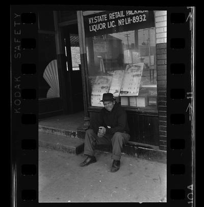 East End Real estate office, African-American man sitting