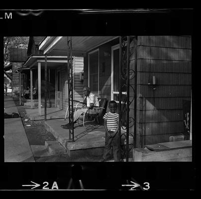 Four children, Man and child on porch