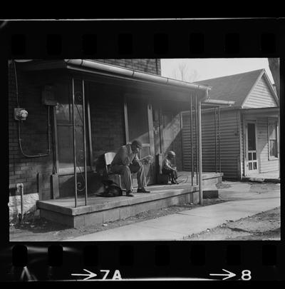 Man and child on porch