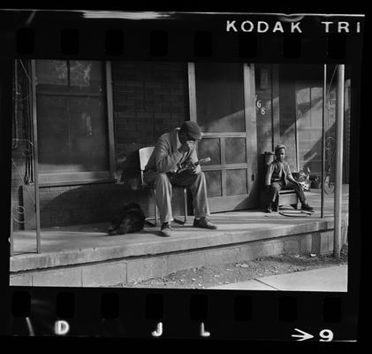 Man and child on porch